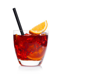 Negroni Cocktail in luxury glass with ice cubes and orange slices with straw on white background with reflection.