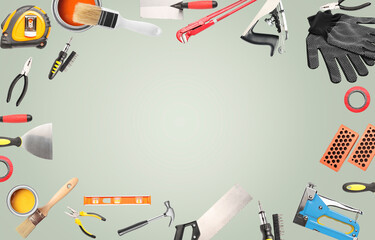Frame made of different construction tools on grey background