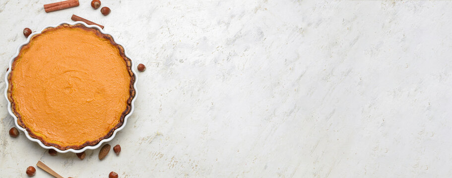 Delicious pumpkin pie on white background with space for text