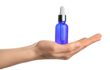 Female hand with bottle of healthy essential oil on white background