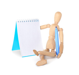 Wooden mannequin with felt-tip pen and notebook on white background