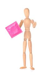 Wooden mannequin with condom on white background
