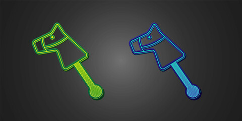 Green and blue Toy horse icon isolated on black background. Vector