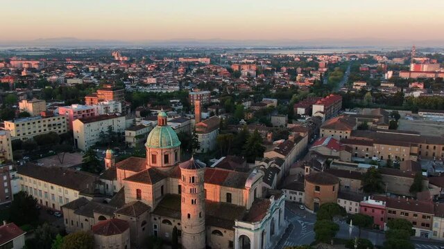 ravenna city aerial view drone flying over roman catholic cathedral of resurrection of jesus christ at sunrise,italian historic centre town shot at dawn