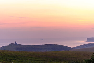 Belle Tout Lighthouse at Beachy Head on South Downs, Chalk cliffs and the English Channel in the distance. Near Eastbourne East Sussex, England UK