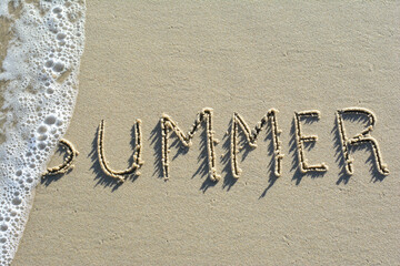  summer word written on the sand at Samui island in Thailand