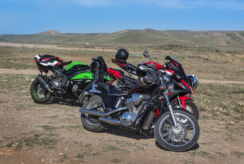 Fototapeta na wymiar Motorcycles in a hilly field