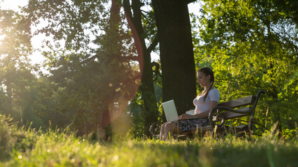 Girl computer tablet work outside. Student woman outdoor with business online technology in summer nature park. Person people with laptop. Happy hipster young distance learning concept.