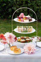 English afternoon tea with cakes and sandwiches