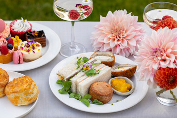 English afternoon tea with cakes and sandwiches