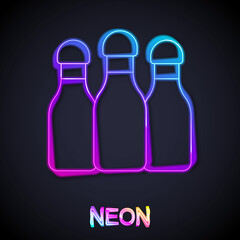 Glowing neon line Bowling pin icon isolated on black background. Vector