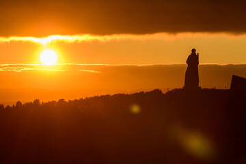 Fototapeta premium Alyosha - Monument to Soldiers - The Soviet Arctic Defenders in Murmansk, Russia. At sunset. Golden hour.