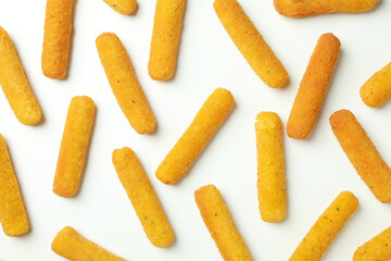 Flat lay with cheese sticks on white background