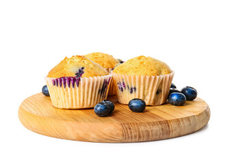 Board with tasty blueberry muffins on white background