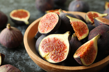 Bowl with fig on black smokey background