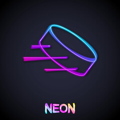 Glowing neon line Hockey puck icon isolated on black background. Vector
