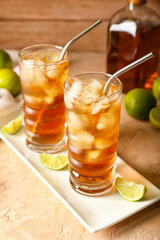 Glasses of tasty Long Island iced tea on table, closeup