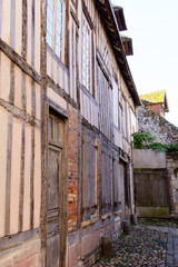 Fototapeta na wymiar streetview in the old town of Honfleur with its typical facades of Norman houses.