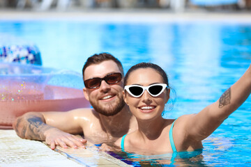Young couple in swimming pool
