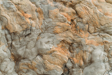 Granular limestone rock surface. Roe stone rock surface. Limestone crag texture. Roe-stone crag face. Limestone stone surface desktop pattern