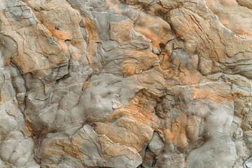 Fototapeta premium Granular limestone rock surface. Roe stone rock surface. Limestone crag texture. Roe-stone crag face. Limestone stone surface desktop pattern