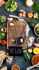 Fototapeta na wymiar Vegan food assortment on dark background.