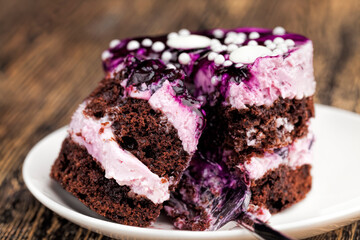 covered with blackberry jam chocolate cake with buttercream