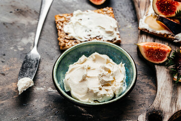 Bowl of cream cheese. Philadelphia cheese crackers. Healthy snack. Food recipe background. Close up