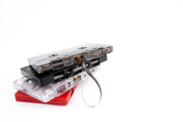 Group of old cassette tapes on white background.