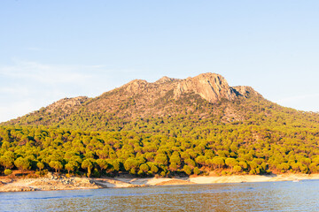 calm, peace and quiet in san juan reservoir in madrid during sunset in autumn