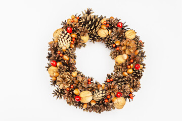 Autumn wreath of cones, nuts, and berries. Creative composition, the handmade