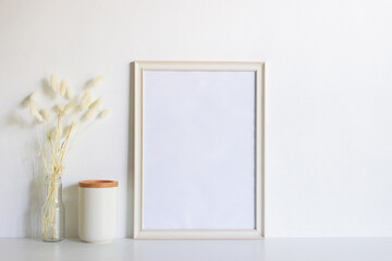 A white blank frame with flowers over the white background. 