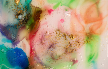 Fototapeta premium Abstract colorful watercolor background. Liquid glass with bubbles and gold dust