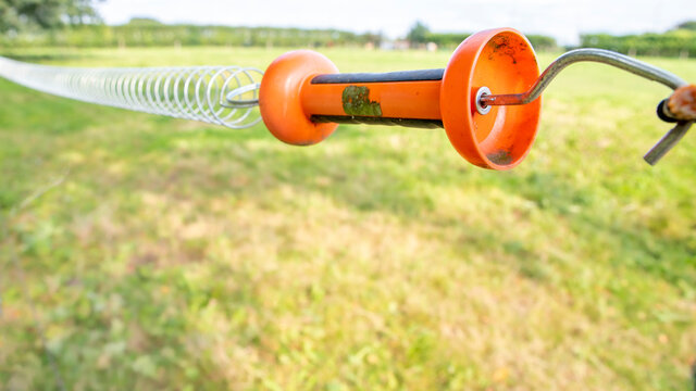 Re gate handle of electric fence system, used on farmland to protect catlle