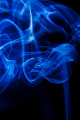 Motion blue smoke on black background.