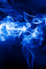 Motion blue smoke on black background.