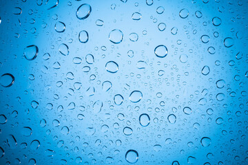 Blue bubble water on glass background. - 458502527