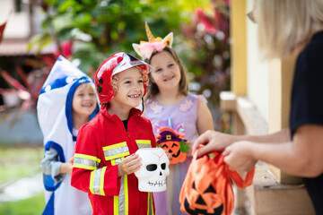 Kids trick or treat. Halloween fun for children.