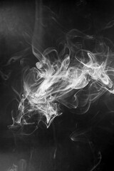 White  smoke motion on black background.