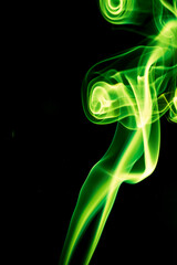 Fototapeta premium Green smoke on black background.