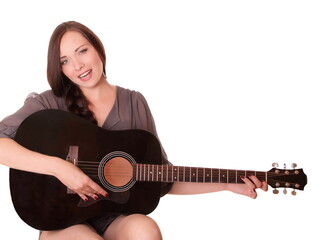 Beautiful young girl sitting with guitar