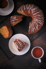 A slice of pumpkin bundt cake served with tea. 
