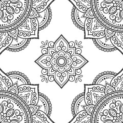 Seamless decorative ornament in ethnic oriental style. Circular pattern in form of mandala and flower for Henna, Mehndi, tattoo, decoration. Doodle outline hand draw vector illustration.