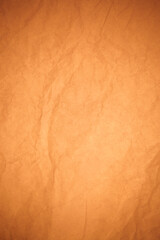 Crumpled brown paper background.