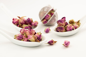 Many beautiful dry pink roses flowers con white background. Dry roses flowers for made a te. Pile of dried roses herbal tea on white background.