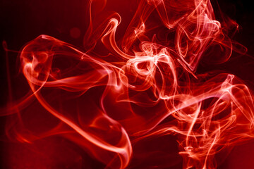 Red smoke motion on black background.