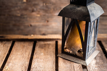 old lantern on a wooden background