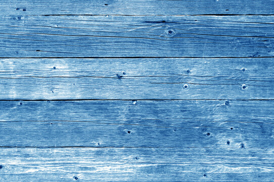 Part of wooden house wall in navy blue tone.