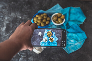 mobile food photography, photo of a phone taking a photo of food