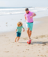 happy kid and dad running on beach in summer vacation with ball, relationship